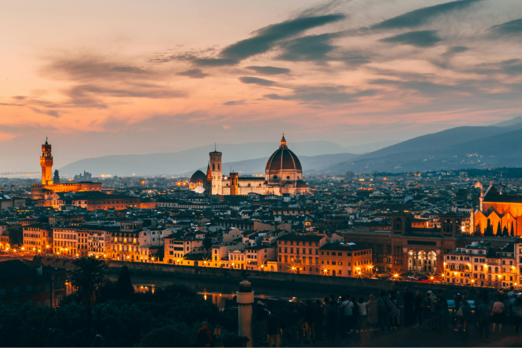The picture represents the evening view of Florence, Italy, one of the attractions in the ultimate travel plan to Europe.