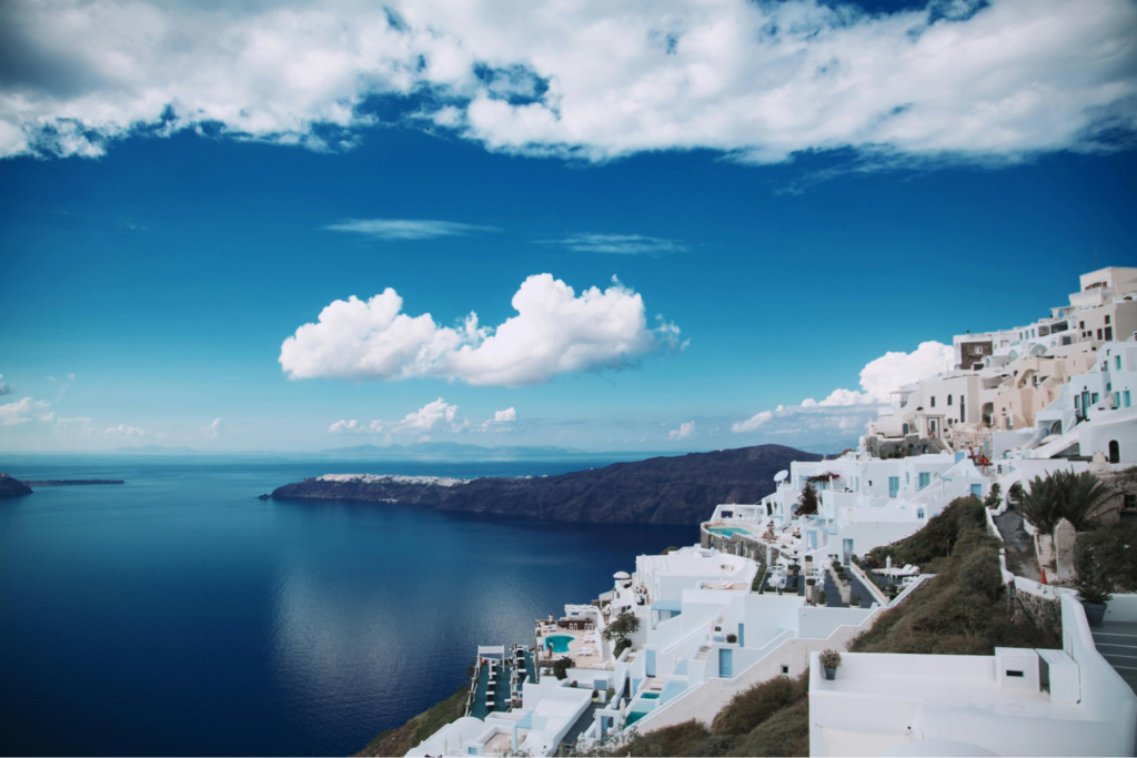 The image depicts the Greek Island, a part of the budget Europe travel plan.