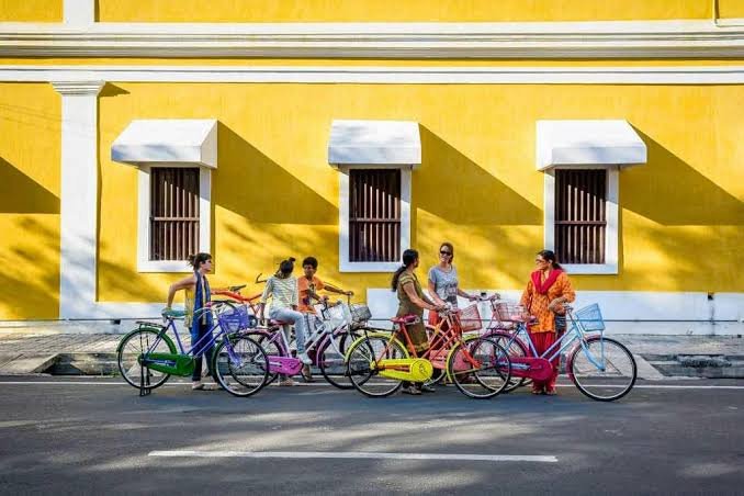 Colourful French colonial street in Pondicherry with cycle rentals – student budget travel to Pondicherry