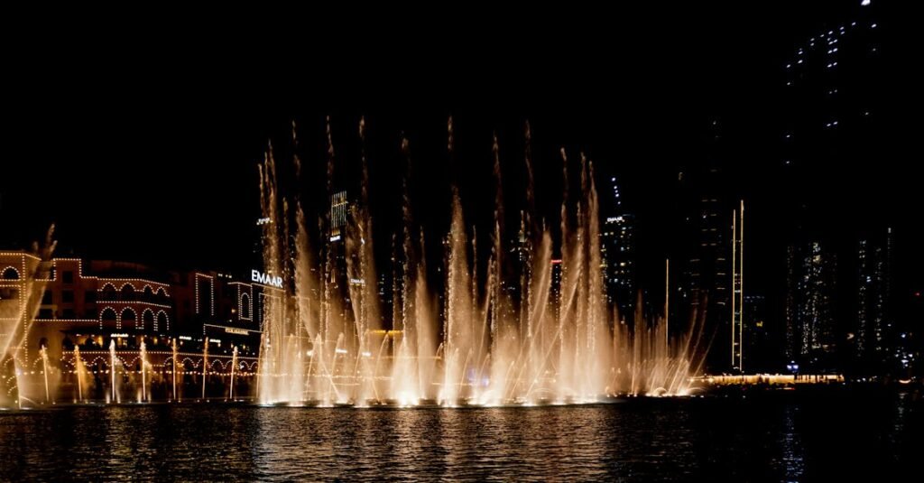 A captivating view of the Dubai Fountain beautifully illuminated against the night sky: A must visit, an Insider travel tips.