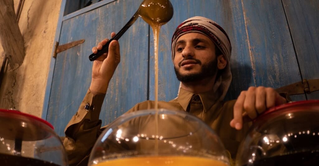 A vendor pouring honey in a traditional Dubai market, showcasing Middle Eastern culture.