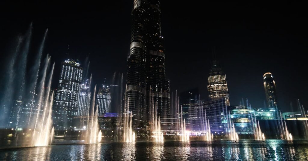 Illuminated Dubai skyline featuring Burj Khalifa and fountains at night: Dubai tourist spots
